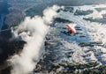 Tourists fly over the Victoria Falls on the trikes. Royalty Free Stock Photo